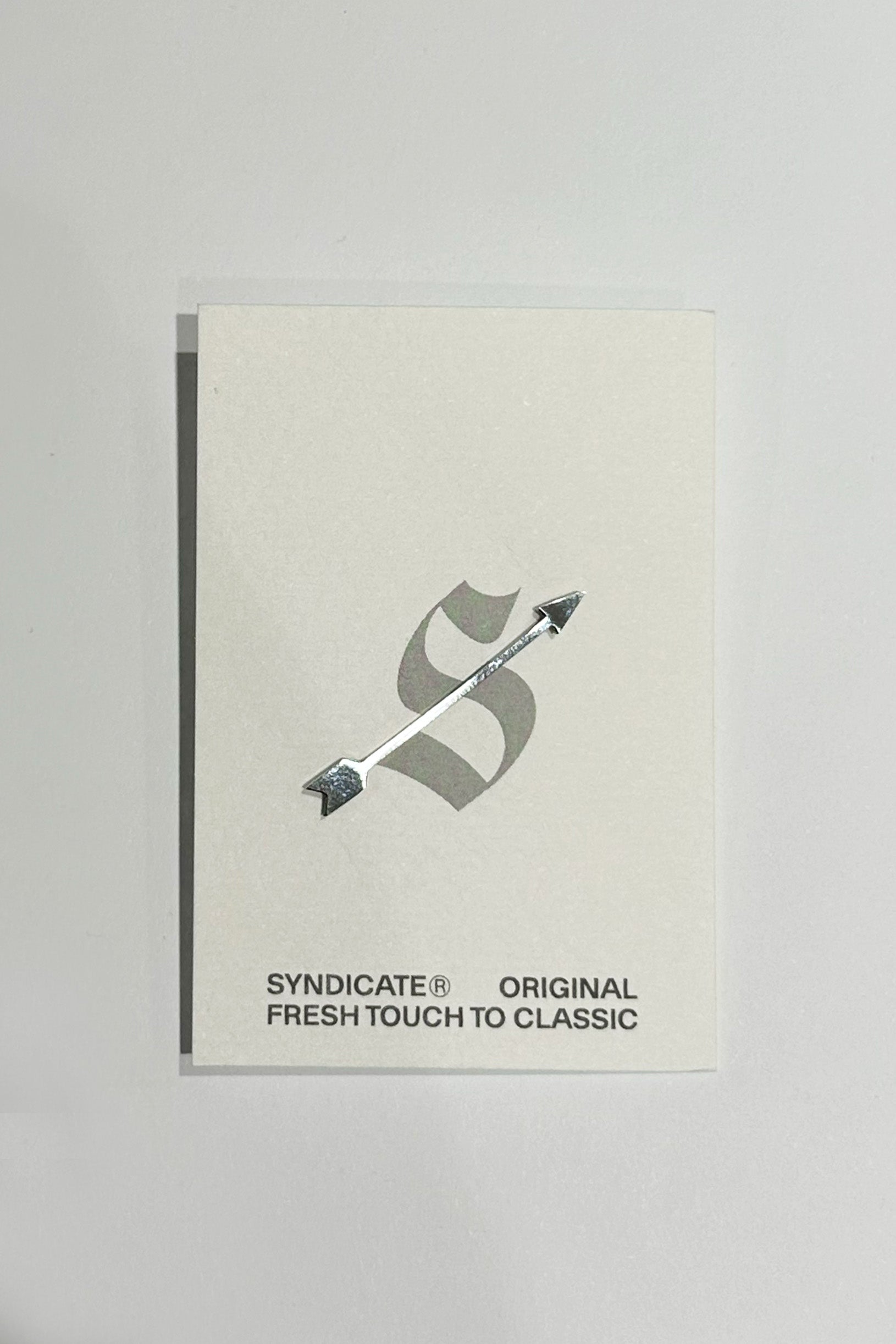 Silvery arrow-shaped pin made of stainless steel