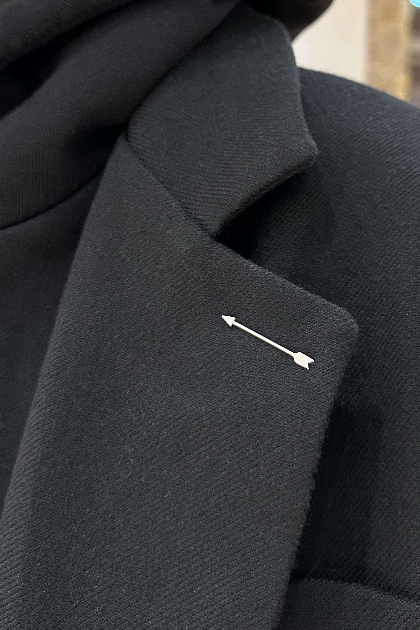Silvery arrow-shaped pin made of stainless steel