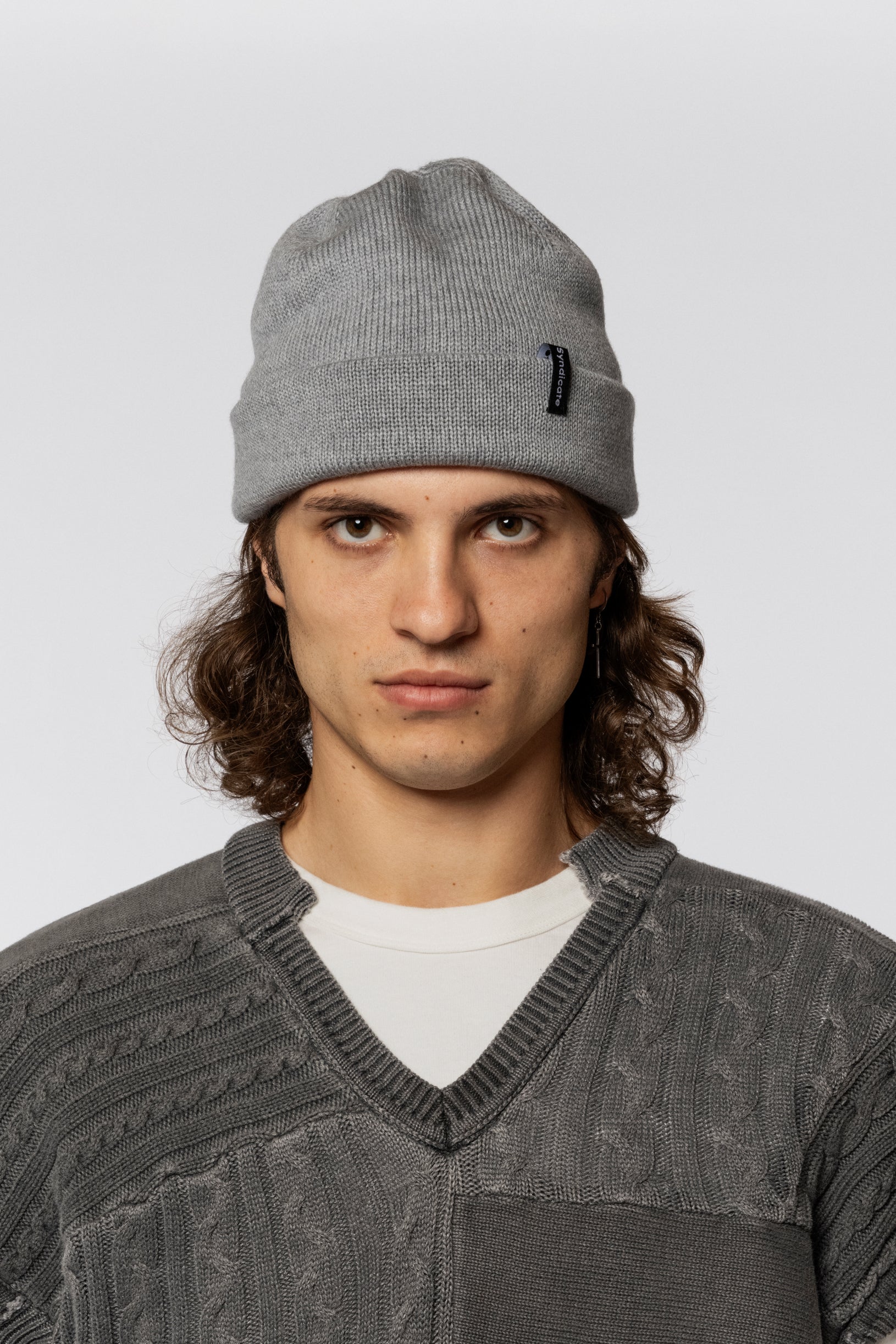 Grey beanie made of merino wool with a Syndicate tag