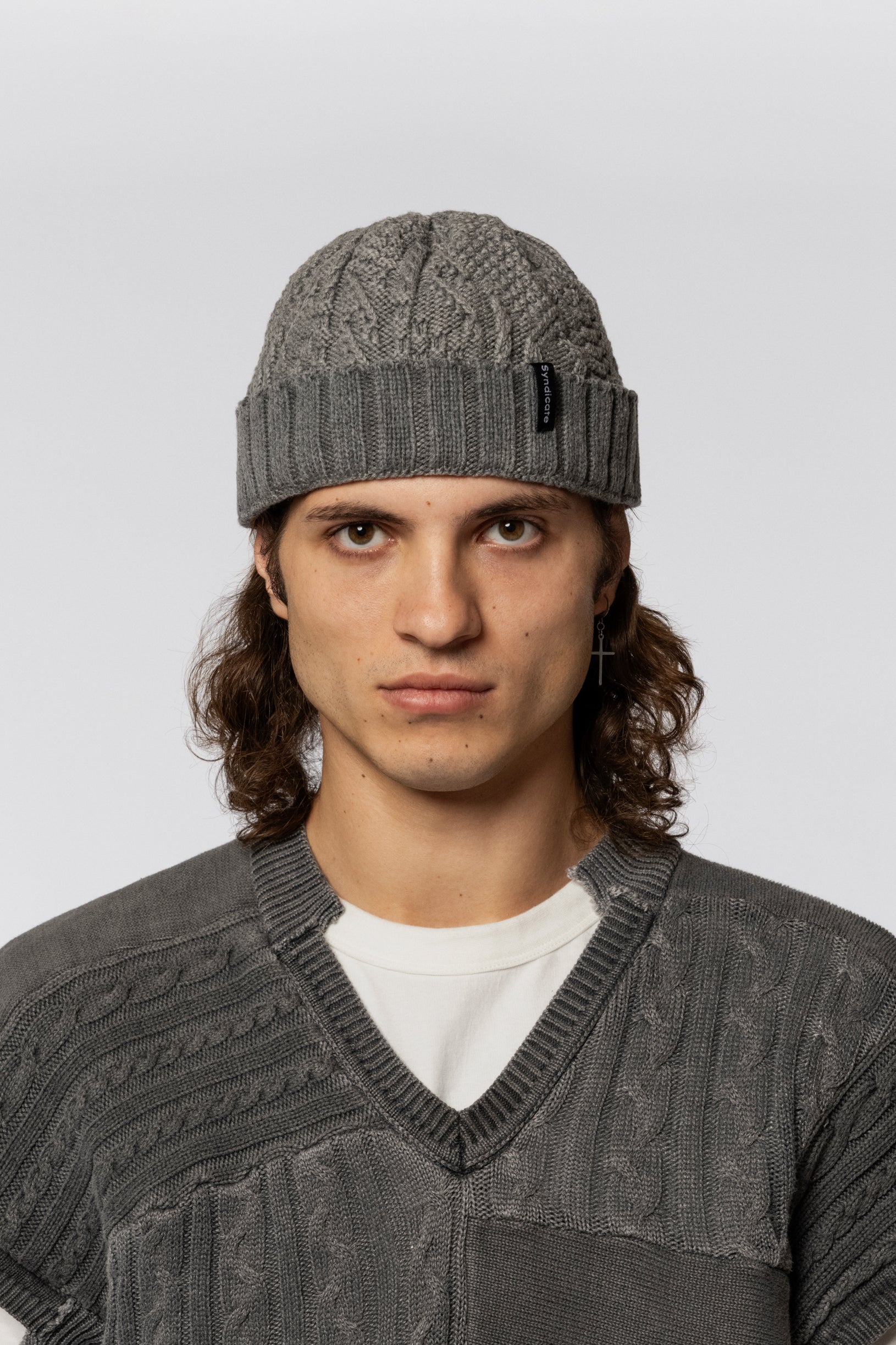 Grey knitted hat with a voluminous texture
