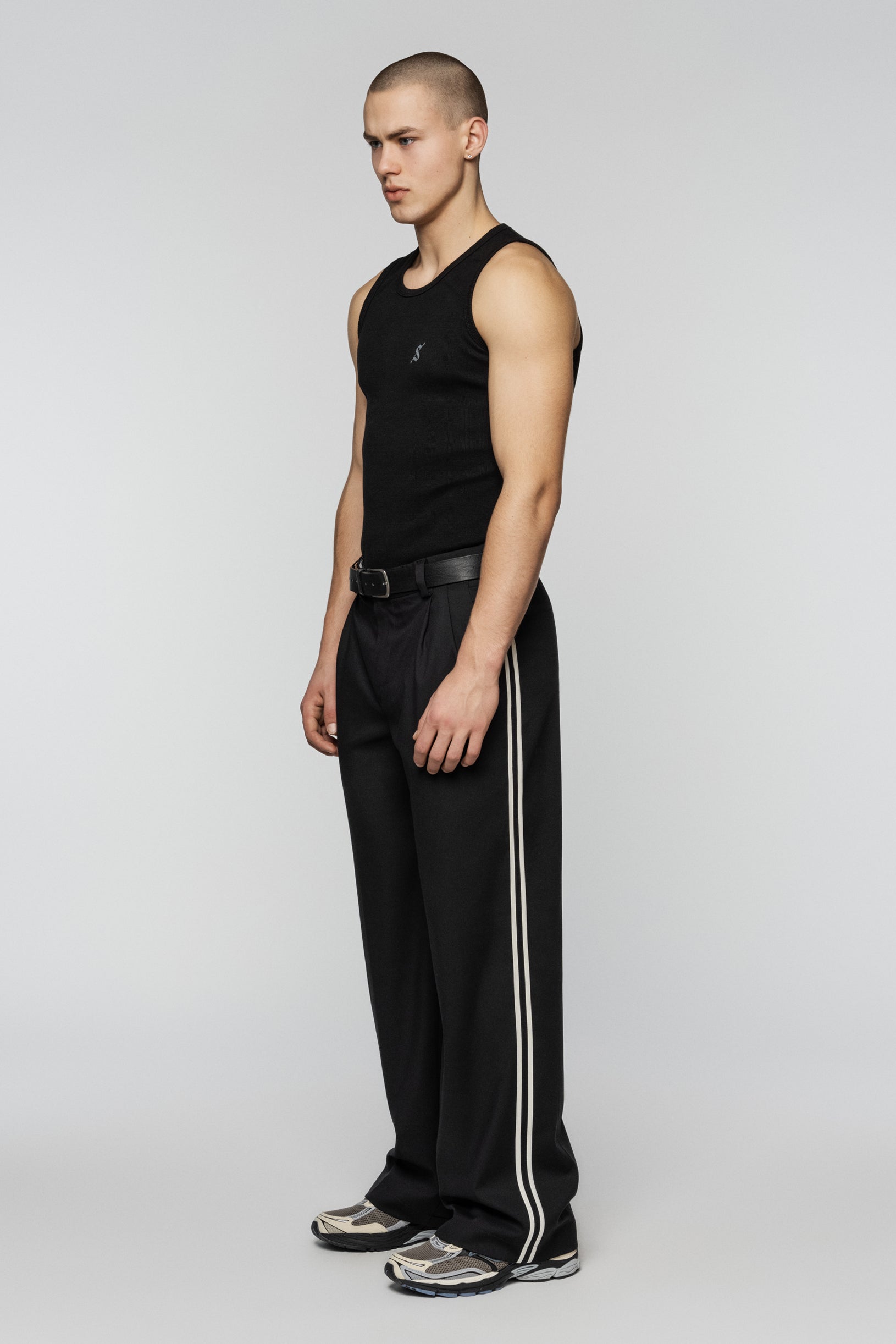 Black viscose pants with stripes and a straight, relaxed cut