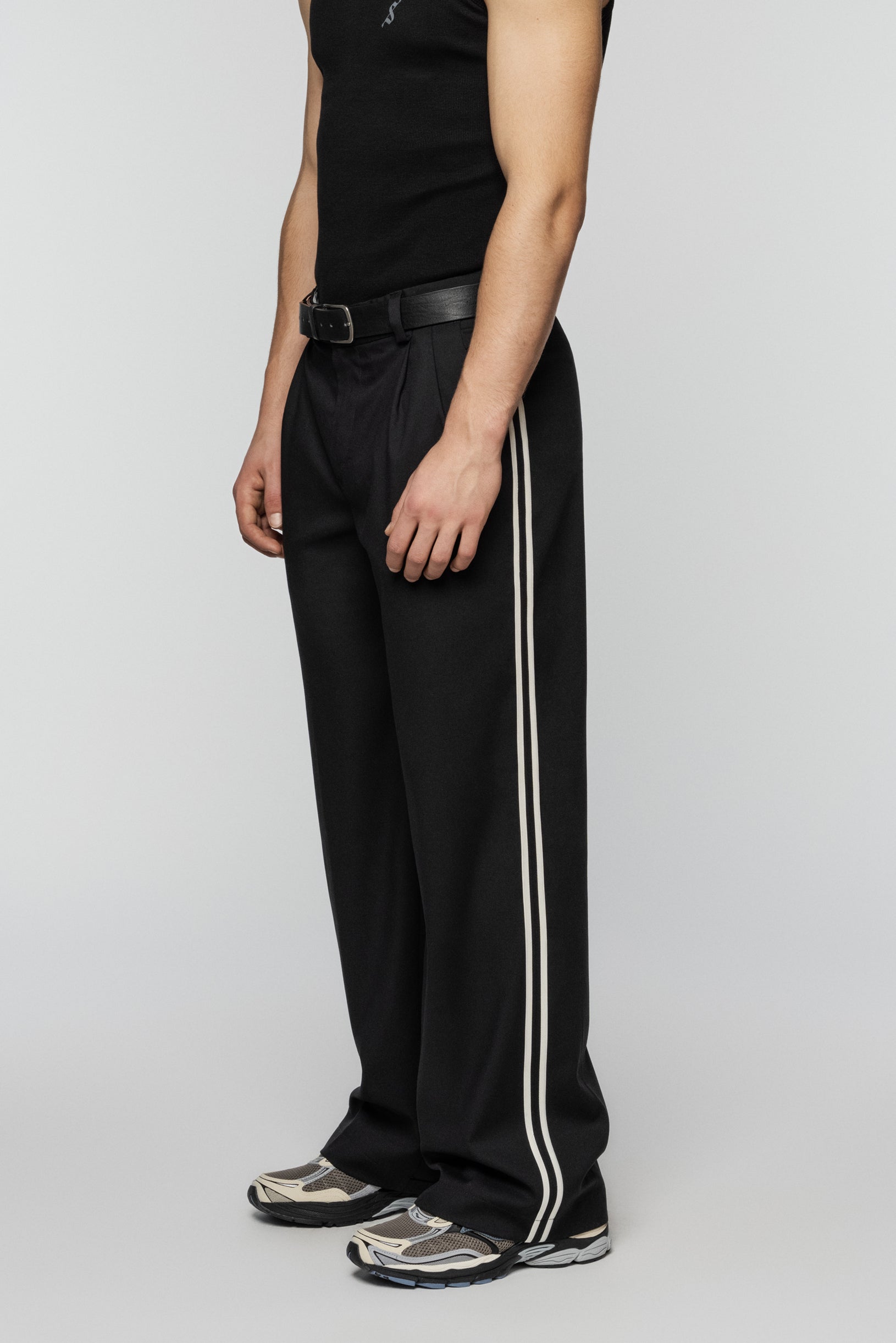 Black viscose pants with stripes and a straight, relaxed cut