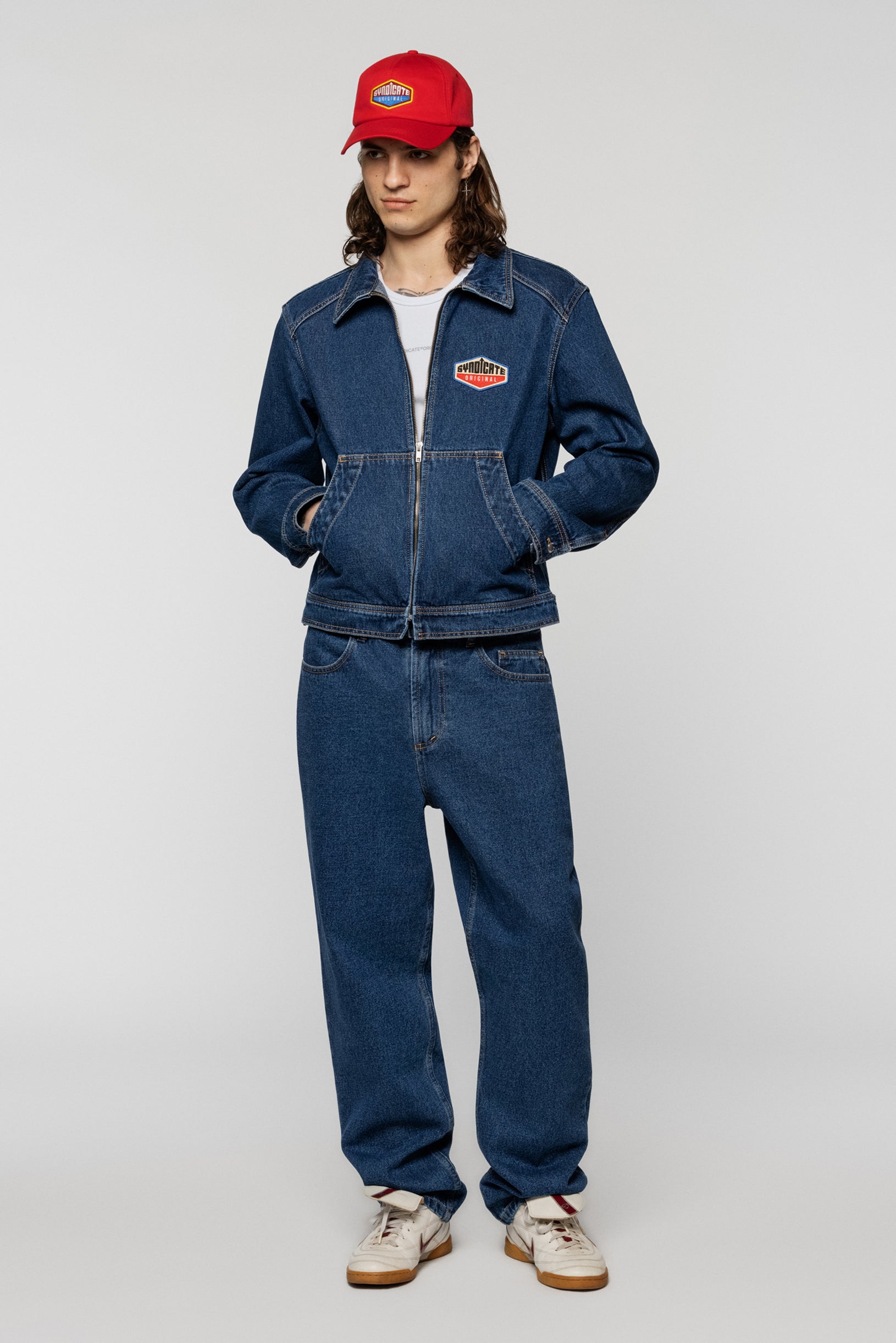 Blue denim jacket with a Syndicate patch