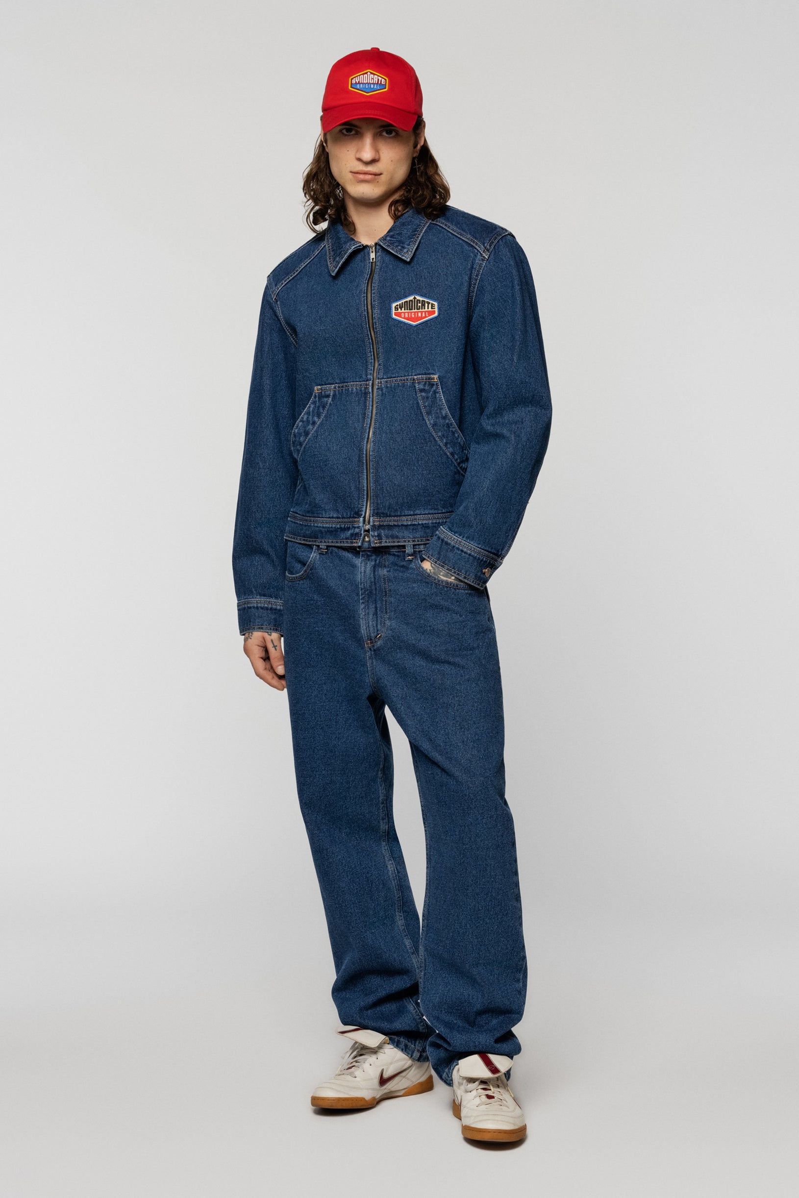 Blue denim jacket with a Syndicate patch