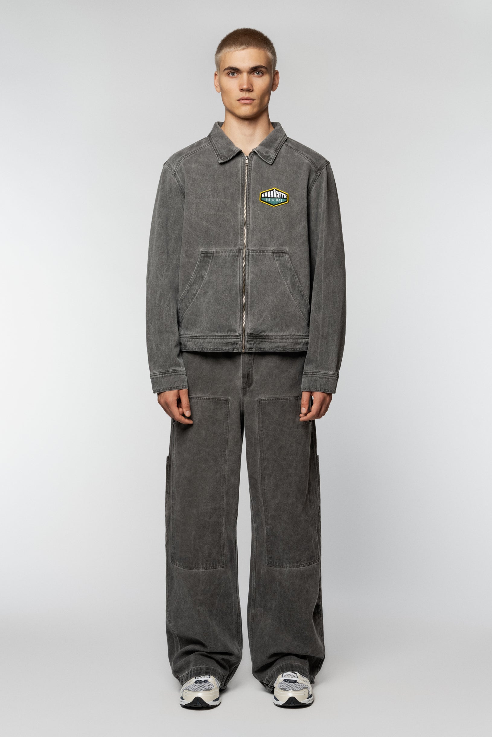 Unisex grey denim jacket by Syndicate with a straight cut