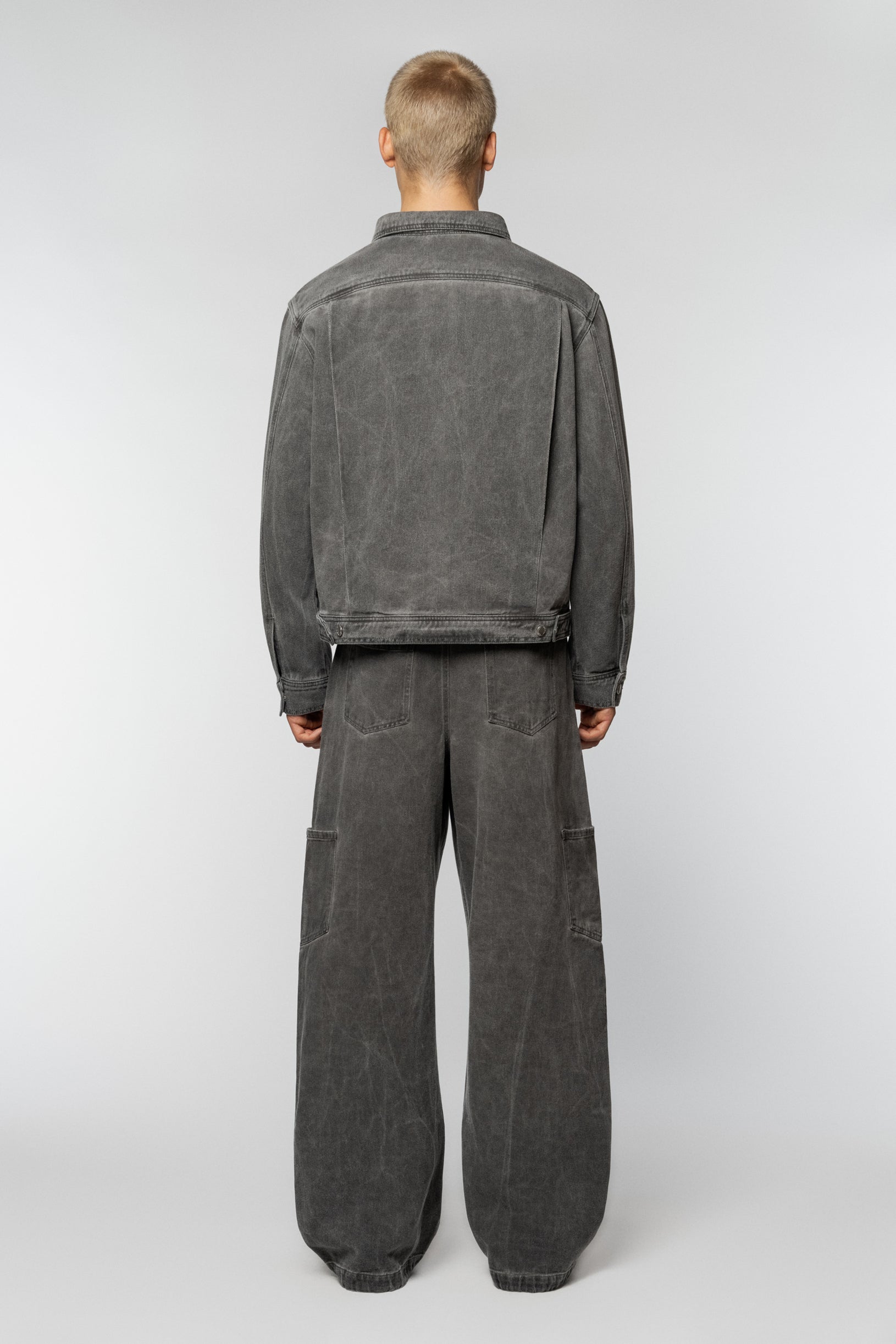 Unisex grey denim jacket by Syndicate with a straight cut