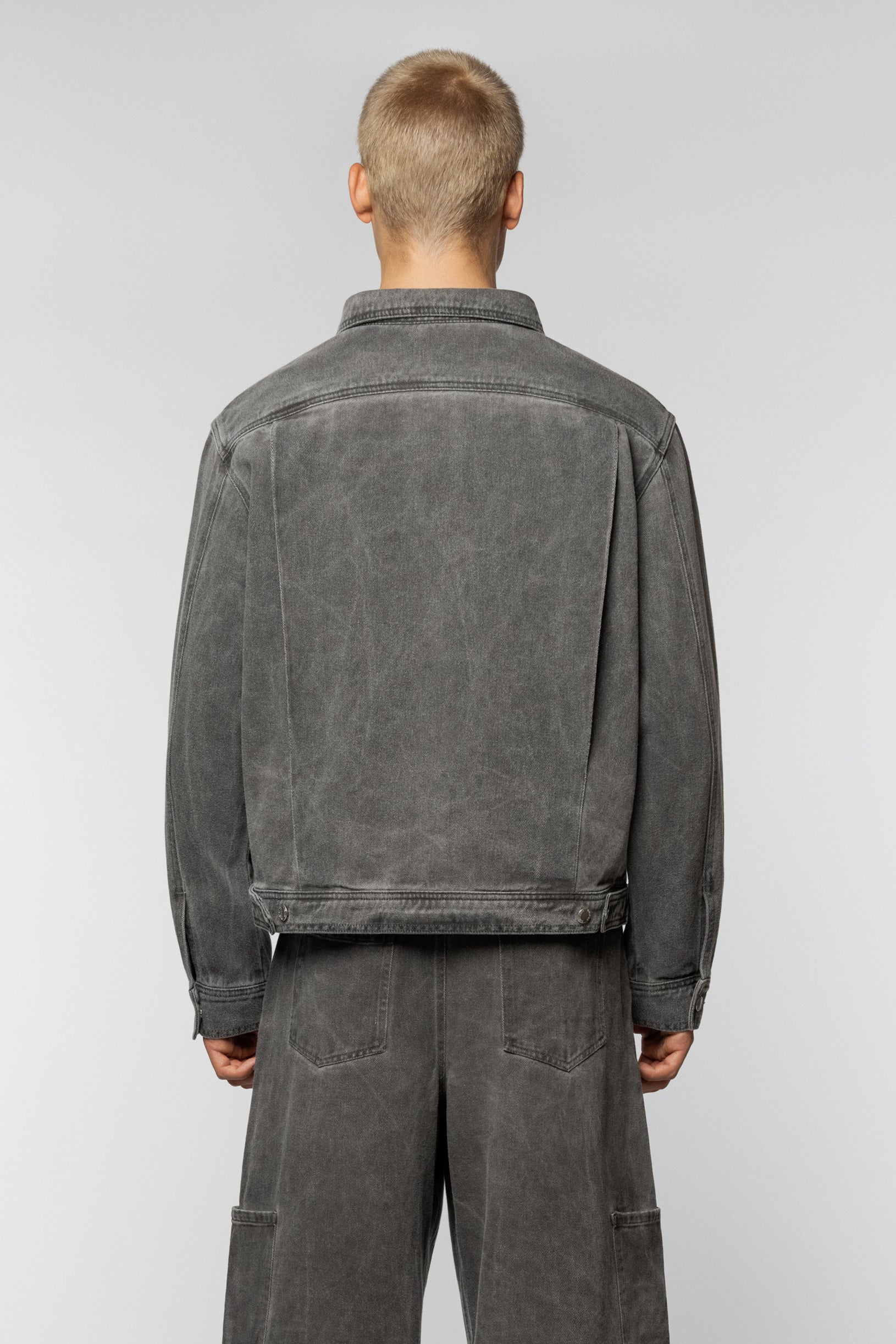 Unisex grey denim jacket by Syndicate with a straight cut
